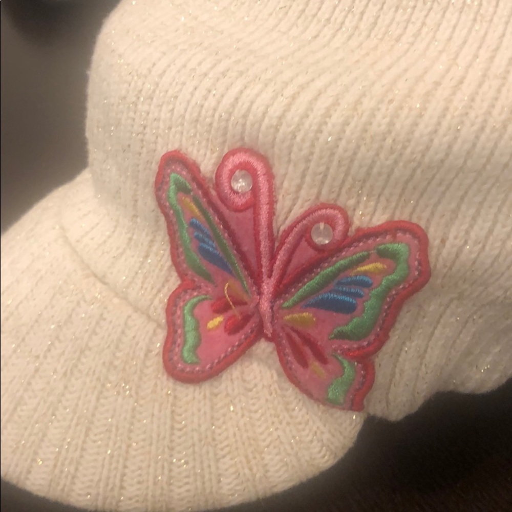 Girls knit hat with butterfly detail.